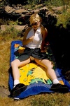 Cute blonde teenie stripping and posing outdoors