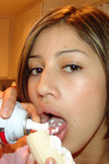 Erotic teen sucking on a big banana