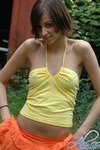 Alyssa teases outside in her bright yellow and orange outfit