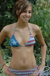Alyssa poses outside in her American flag bikini