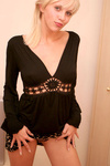 Daring hot babe pops out her juicy tits out of her black blouse