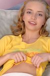 Check out adorable Ashley Lightspeed wearing sunny yellow as she relaxes at home in bed